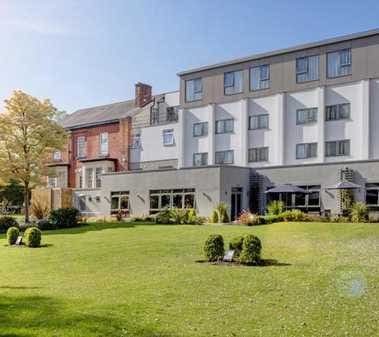 Landscaped grounds and grass areas at a hospitality venue